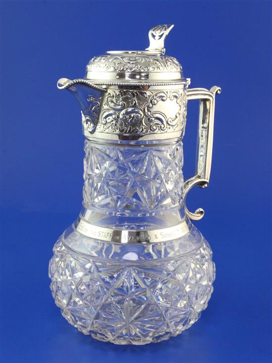 A George V silver mounted cut glass claret jug by Goldsmiths & Silversmiths Co Ltd, 10in.